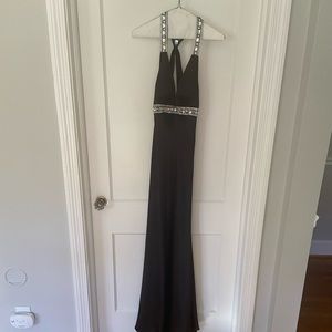 Black Faviana Couture gown with open back and gemstone straps